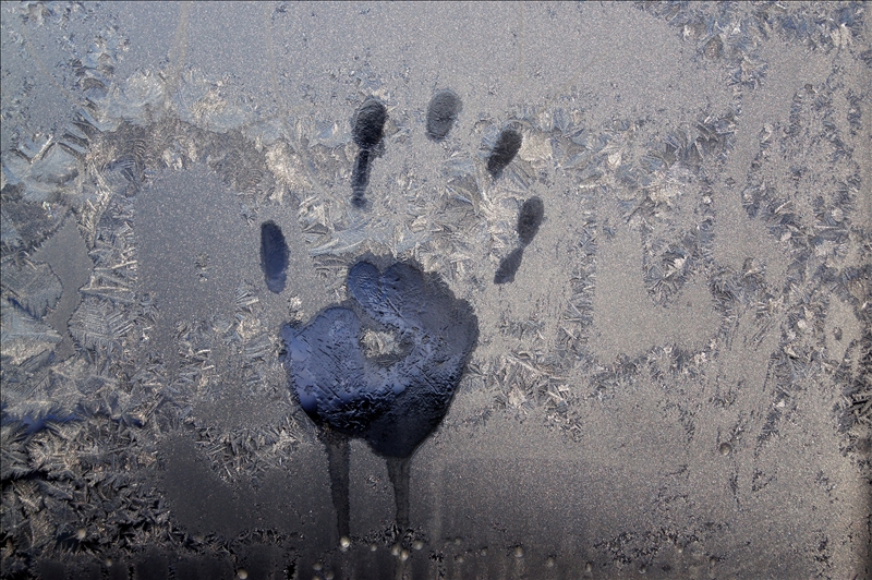 Handprint on icy window