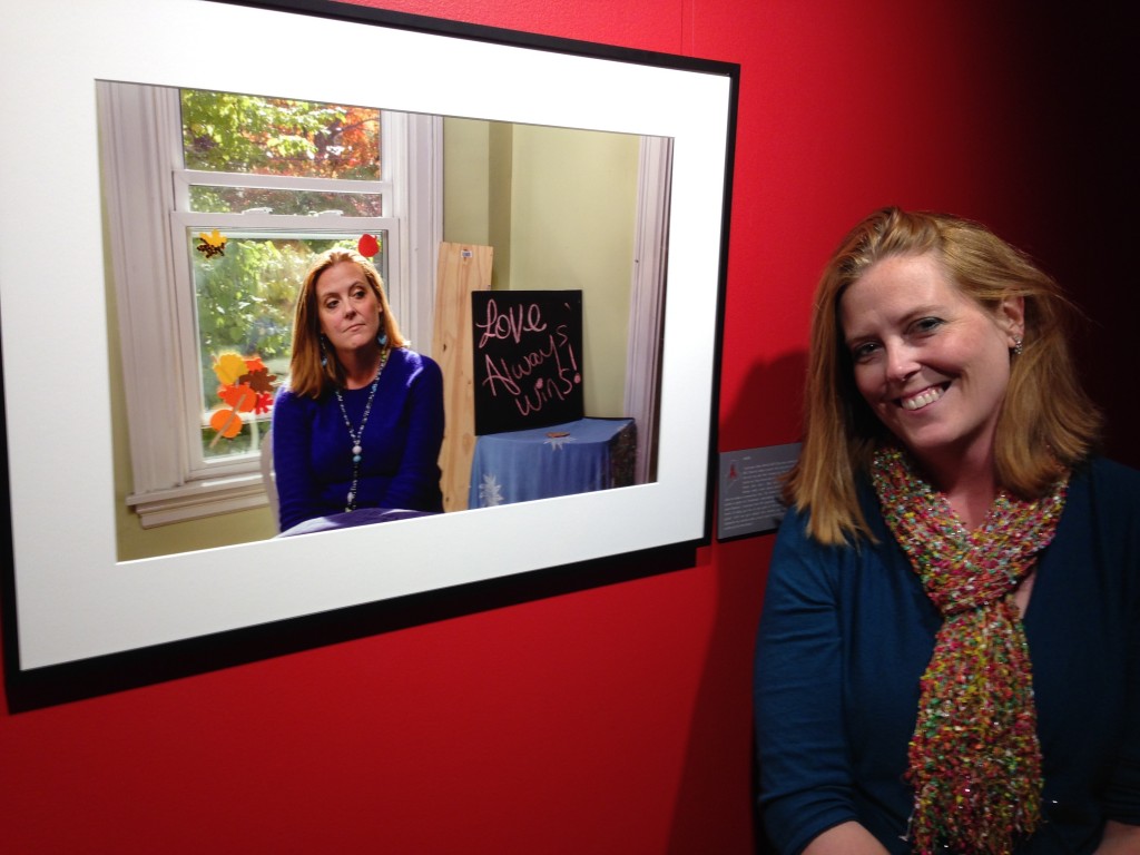 Aimee LeBlance beside her portrait