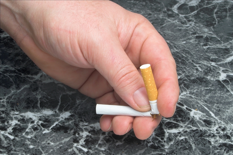 Person breaking a cigarette