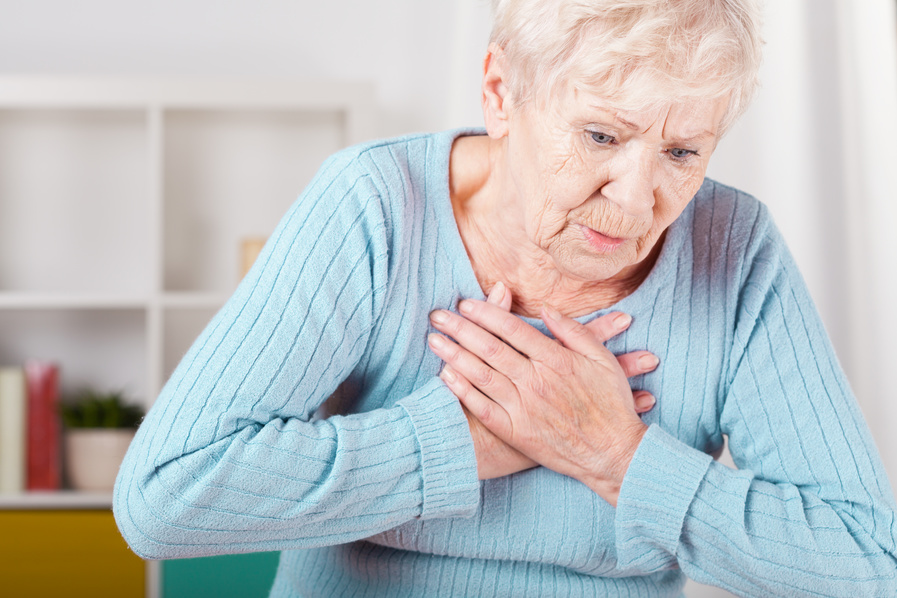 Woman clutching heart