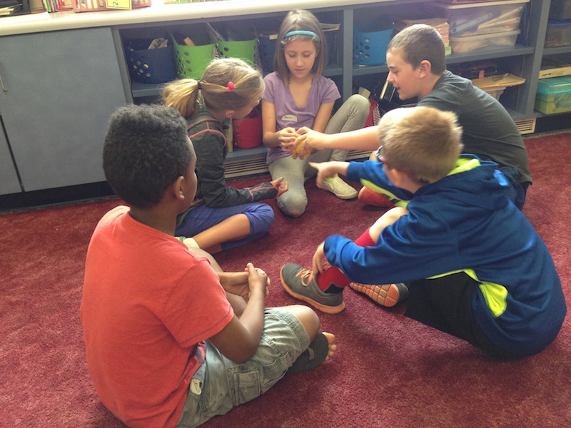 Students looking at a lemon