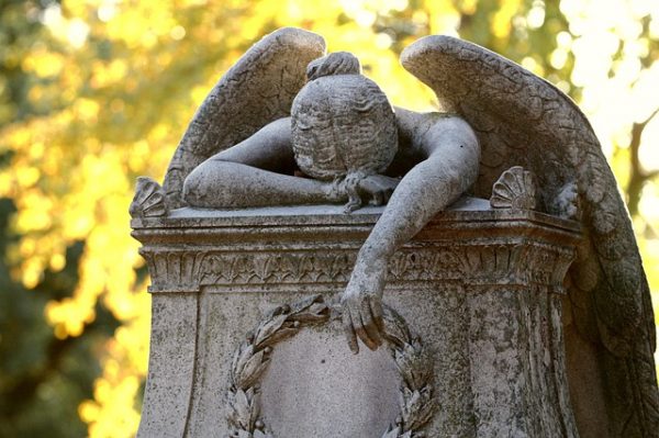 Grieving angel cemetery monument