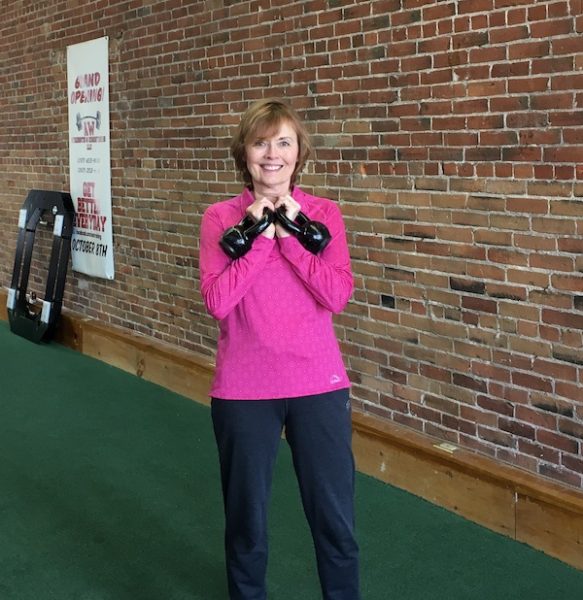 Diane exercising with kettlebells