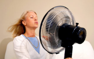 Woman with fan/menopause