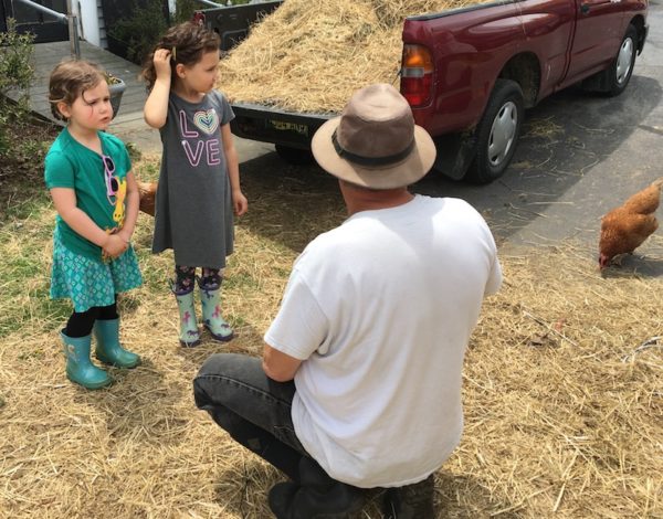 Michael talking to Nora and Lucia about the goats