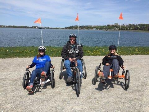 Two Hanger clinicians and a patient on adaptive cycles