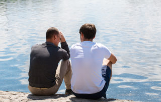 Two men talking on the dock