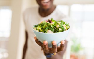 Person holding salad