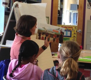 Kelly reading book to students