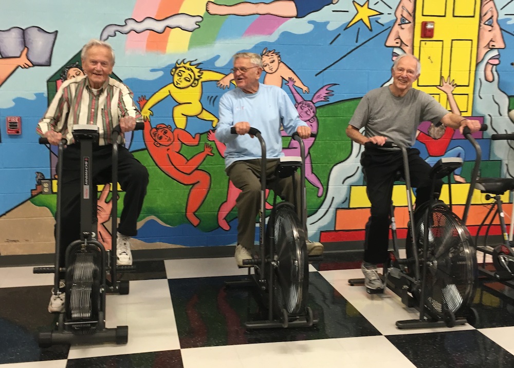 Three men on bikes