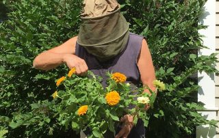 Person wearing hat with veil