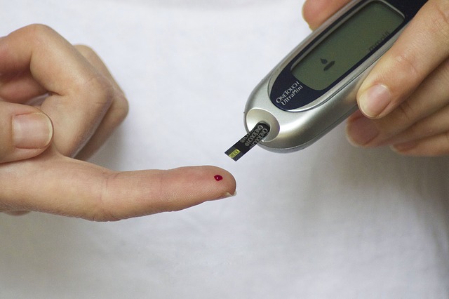 person with diabetes testing blood sugar