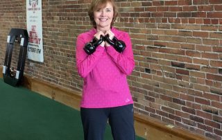 Diane exercising with kettlebells