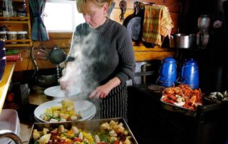 Annie Mahle cooking in the schooner galley