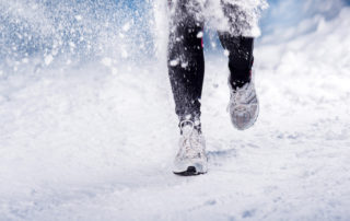 Feet running in snow/Adobe