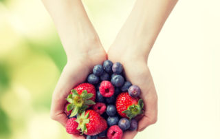 Woman holding berries/MIND diet