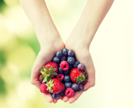 Woman holding berries/MIND diet
