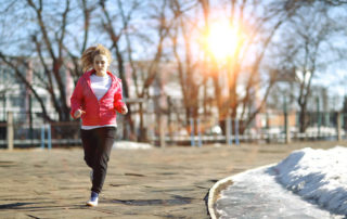 Woman running in early spring