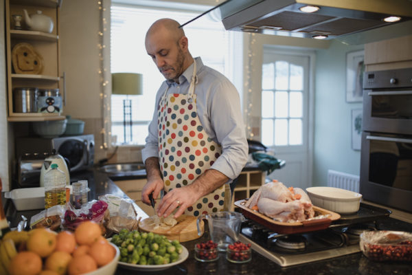 Man preparing a turkey dinner