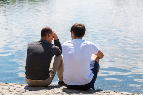 Two men talking on the dock