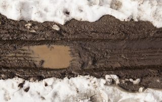 tire tracks in muddy snow