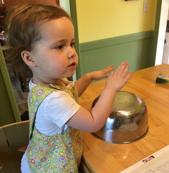 Playing an upside down bowl "drum"