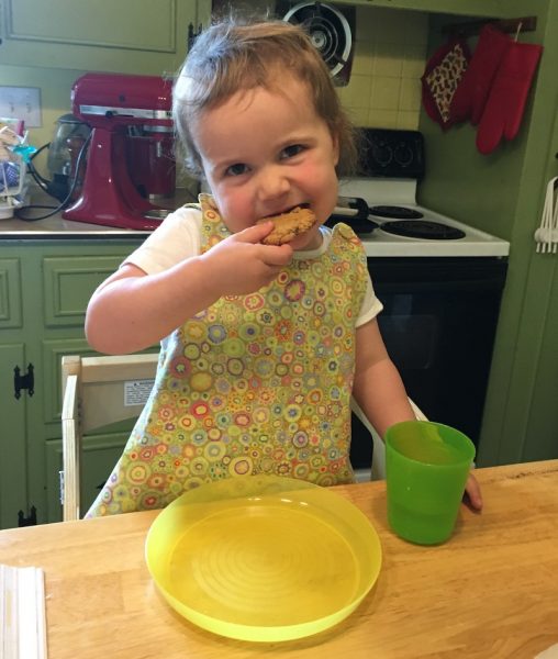 Granddaughter eating a peanut butter cookies