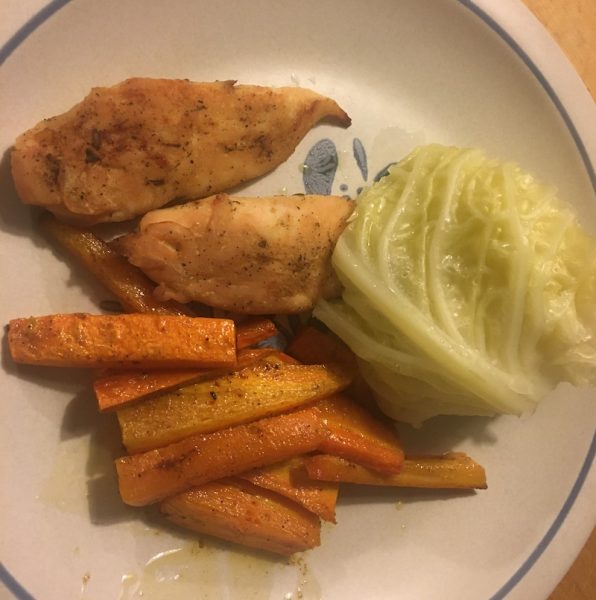 Plate of chicken, carrots, and cabbage